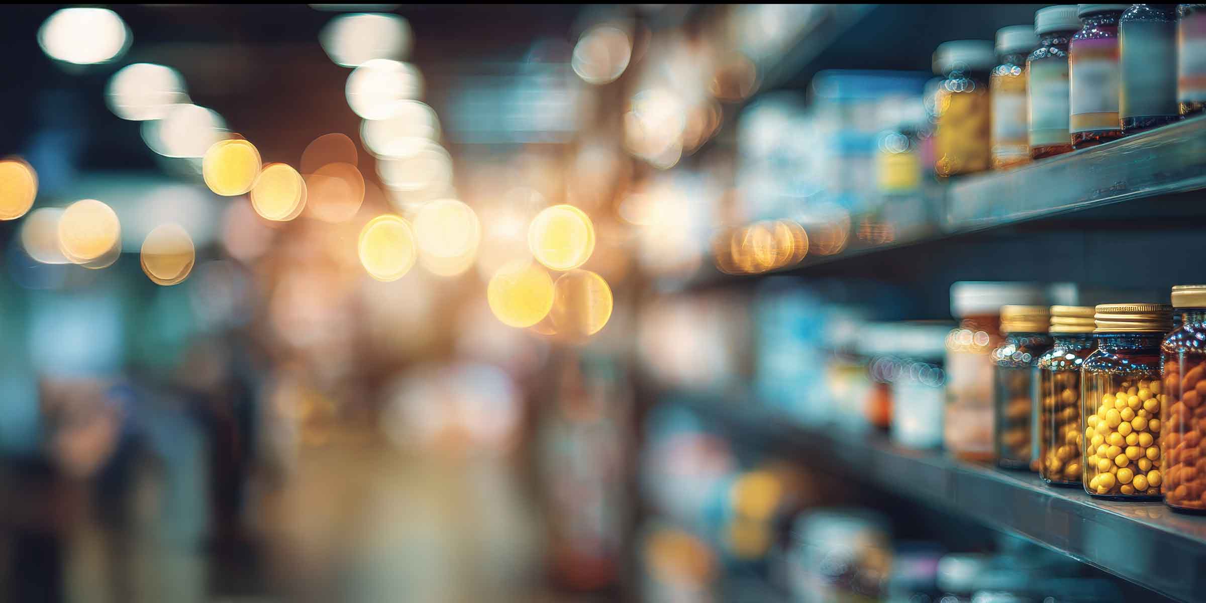 Image of supplements on market shelves soft light in background