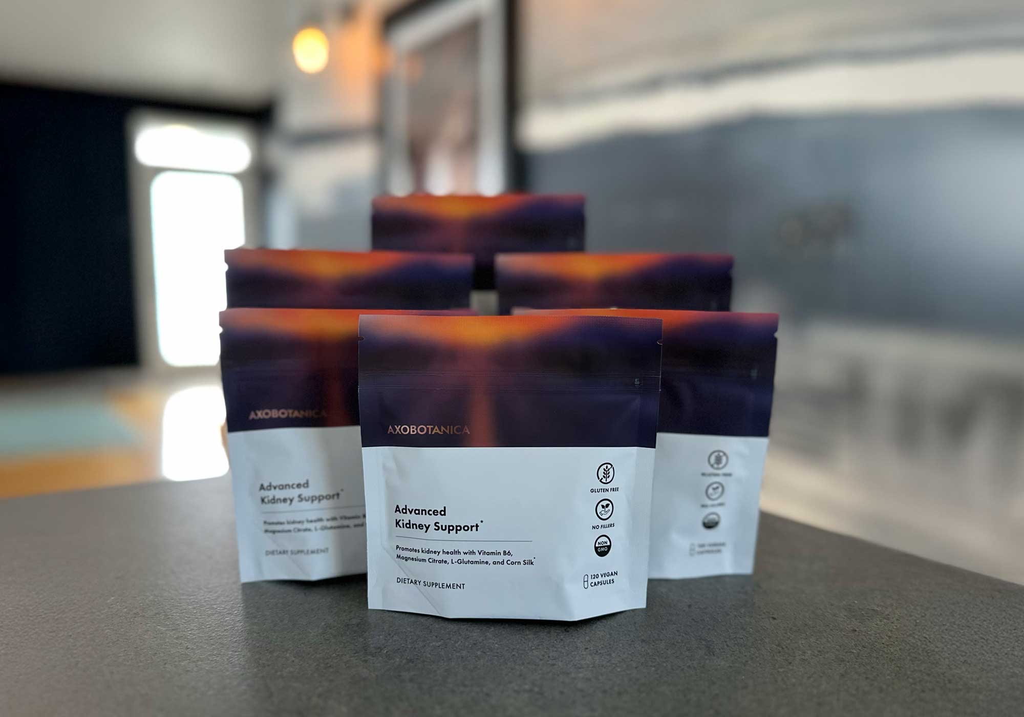 Packages of 'Advanced Kidney Support' on a counter with a blurred background