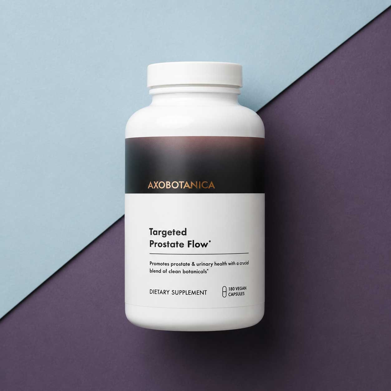 A white bottle of Axobotanica Targeted Prostate Flow dietary supplement, positioned on a diagonally split background of light blue and dark purple.
