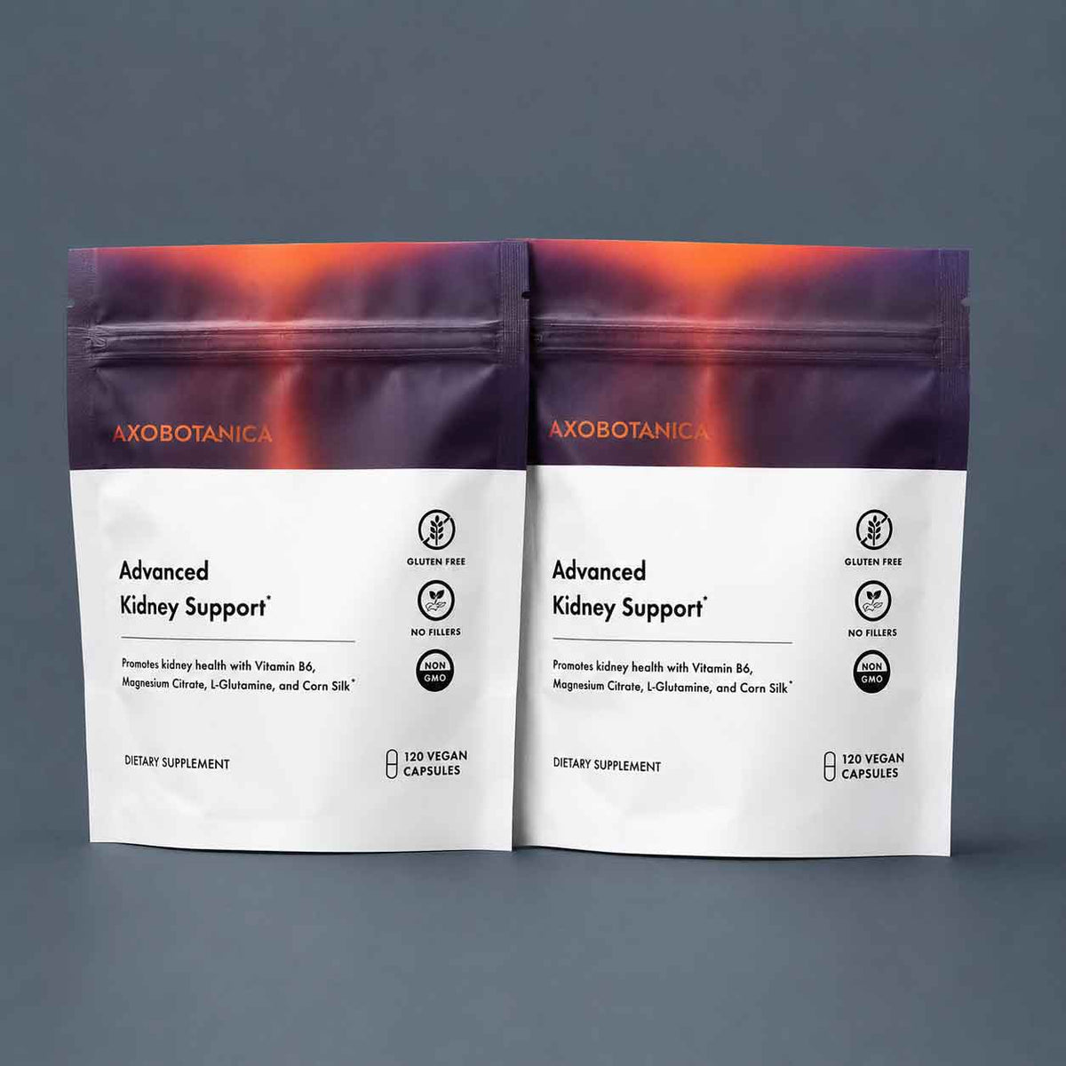Two pouches of Axobotanica Advanced Kidney Support dietary supplement on a slate background