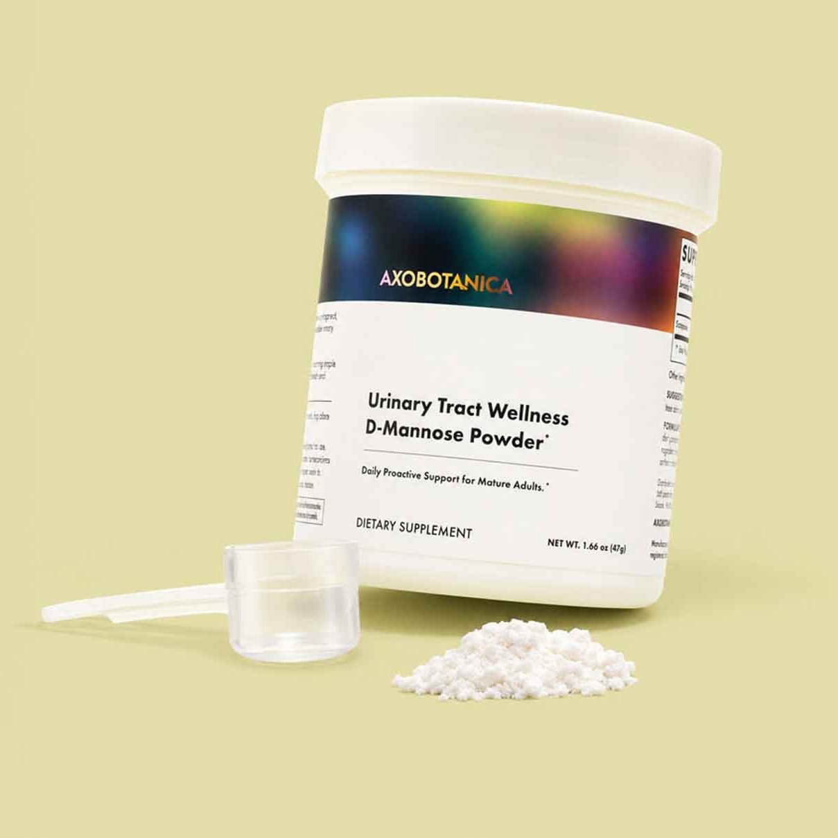 A jar of Axobotanica Urinary Tract Wellness D-Mannose Powder with a white scoop and a small pile of white powder