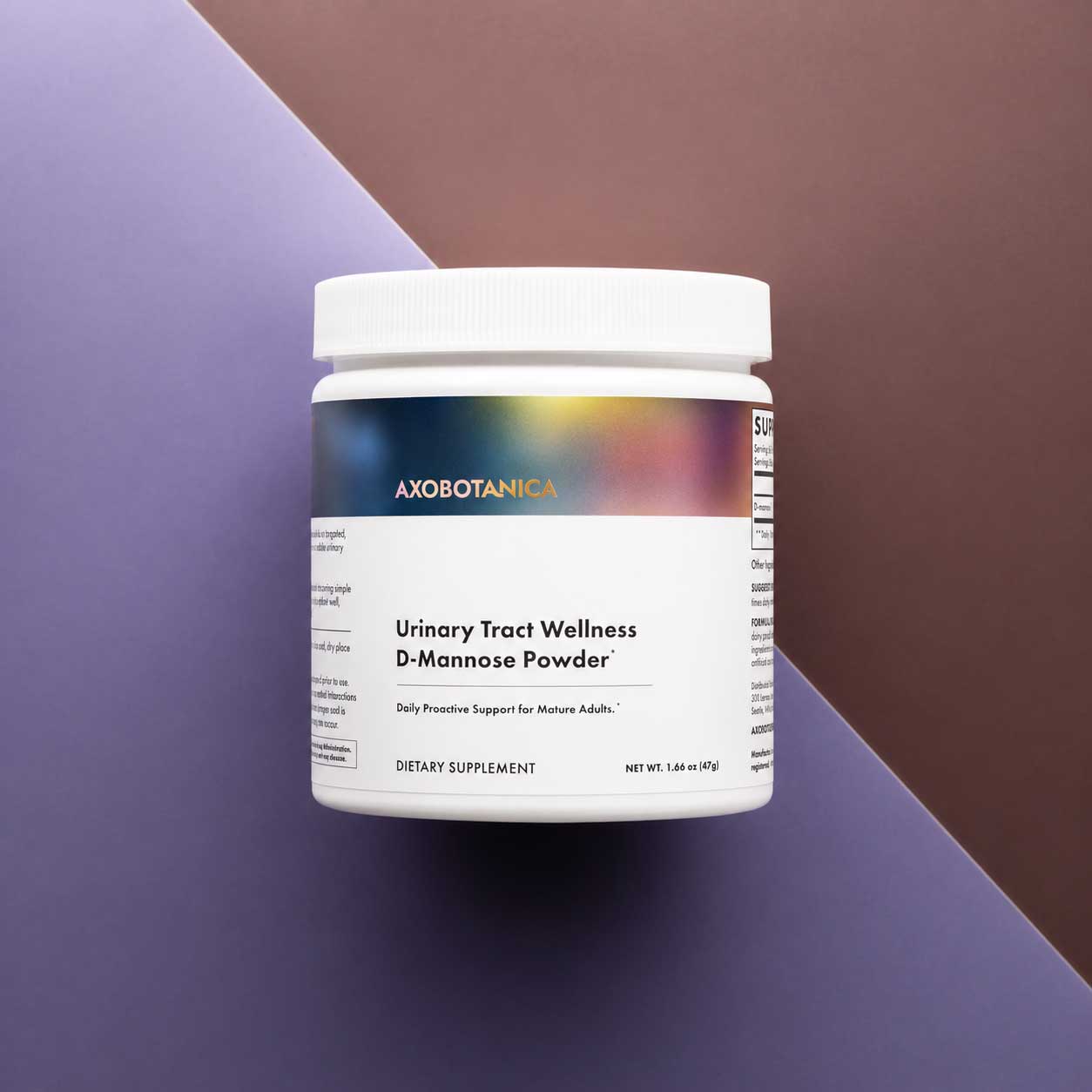 A white plastic jar of Axobotanica Urinary Tract Wellness D-Mannose Powder, set against a split purple and brown geometric background.