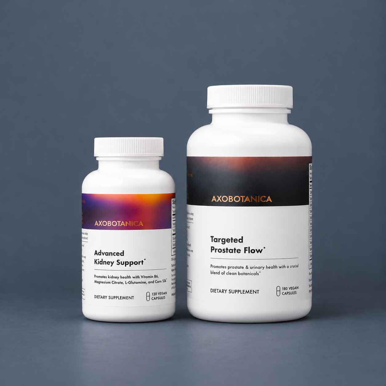 An Axobotanica Advanced Kidney Support bottle beside a bottle of Targeted Prostate Flow on a dark slate background