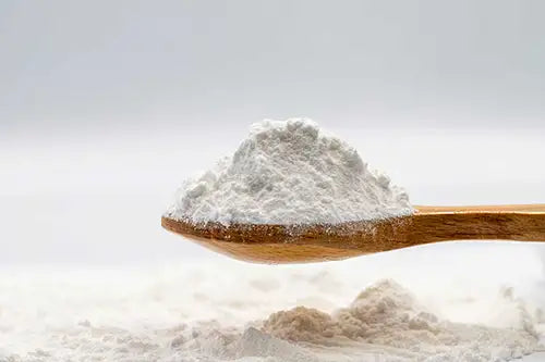 White powder on a wooden spoon