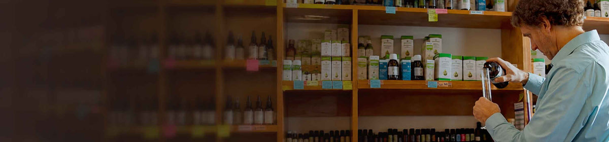 Dr. Chris mixes a formula in his clinic's medicinary.